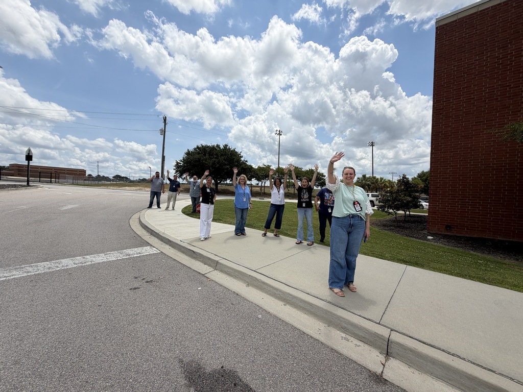 Faculty and staff wave goodbye to students on the school buses leaving Fulmer for summer break.