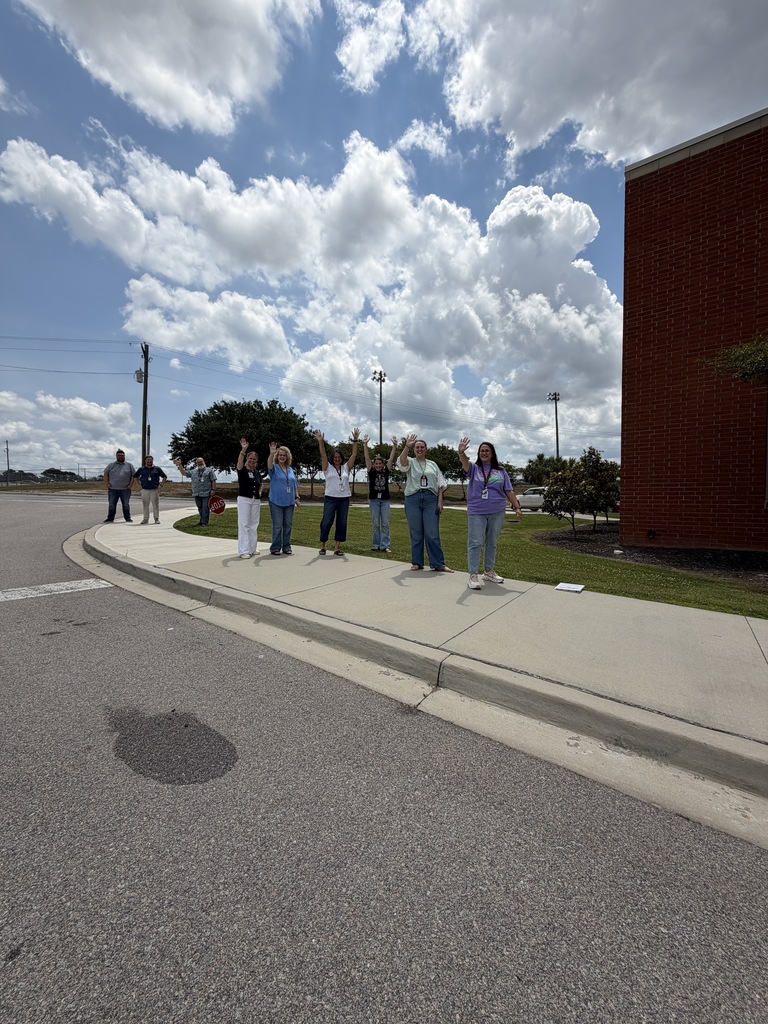 Faculty and staff wave goodbye to students on the school buses leaving Fulmer for summer break.