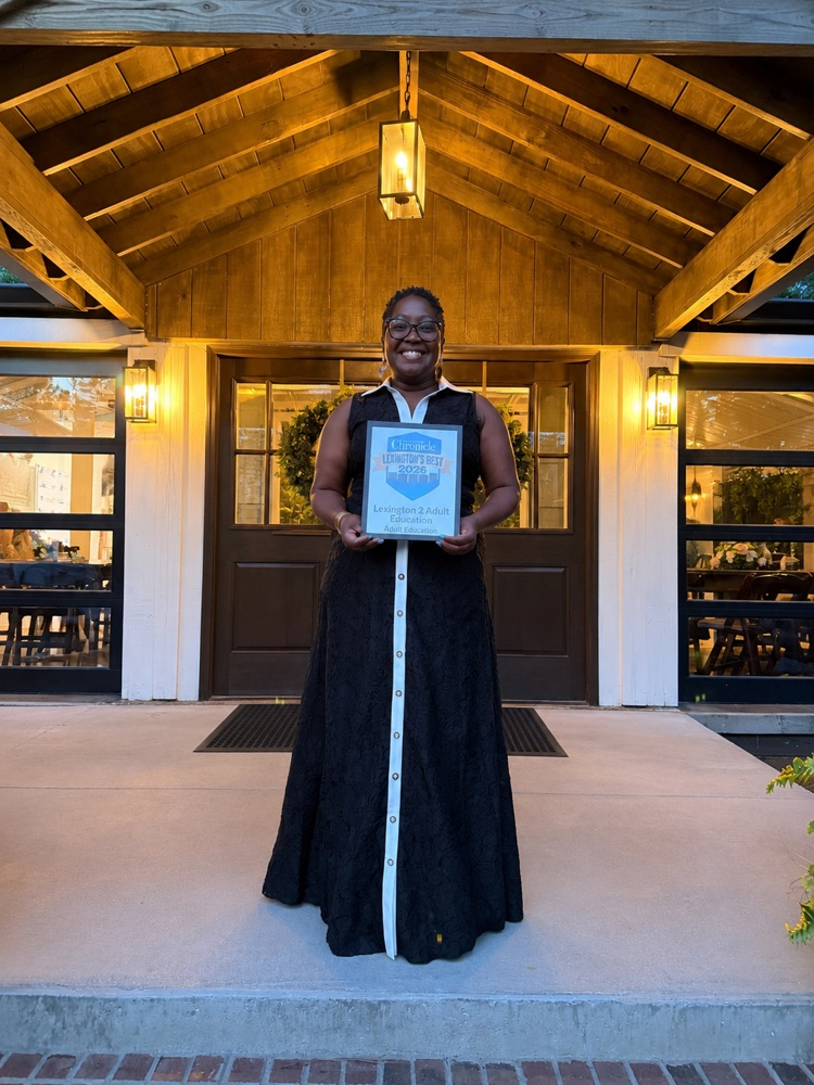 person holding award