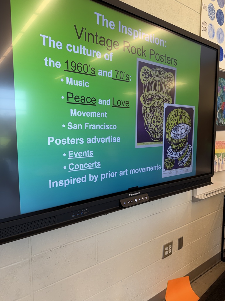 Promethean board in the Art Classroom displays information regarding the inspiration behind vintage rock posters and the culture of the 1960s, and 1970s.