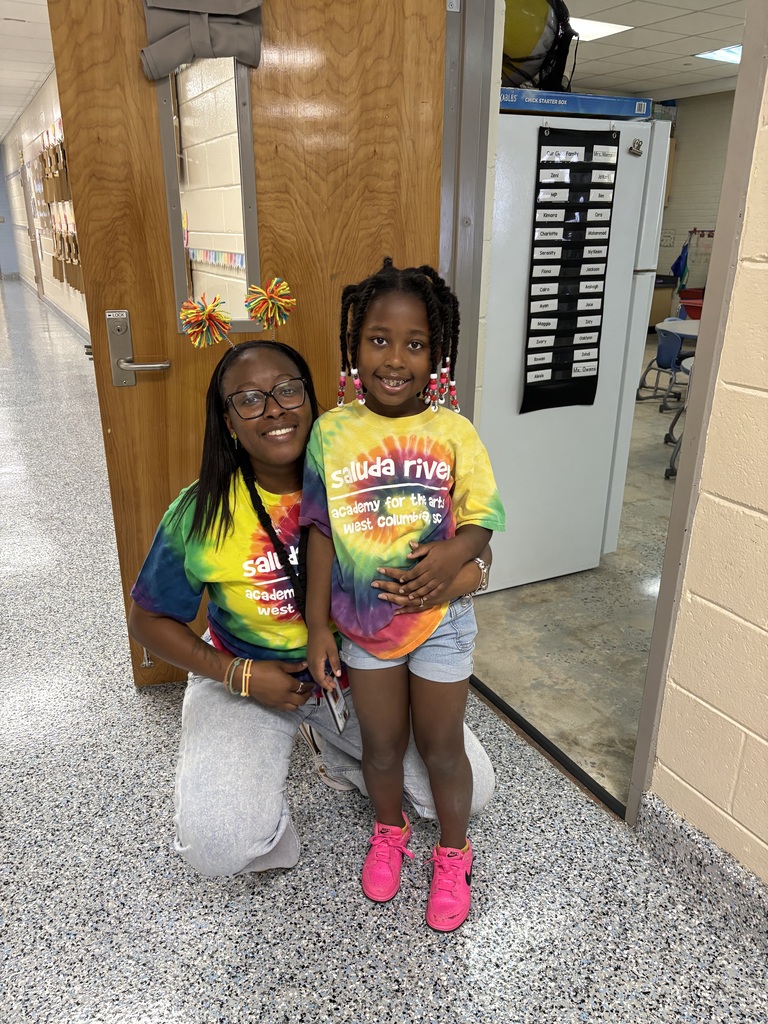 Teacher and Student wearing mathing spirit day shirts