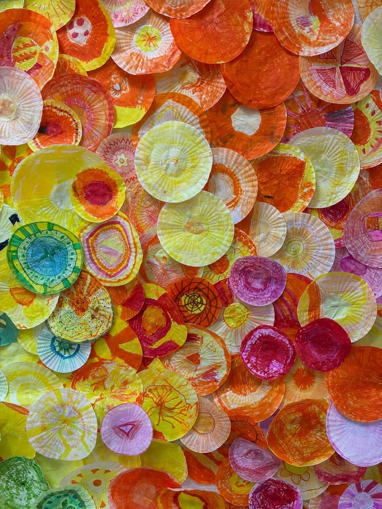Display of paperplates painted into a display