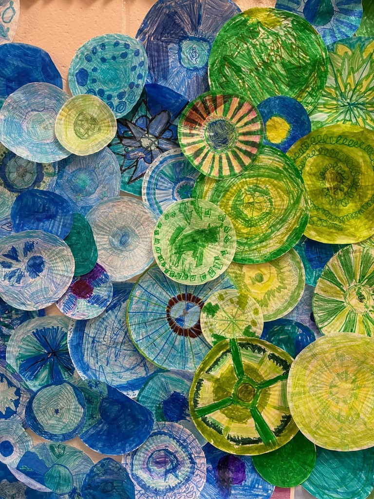 Display of paperplates painted into a display