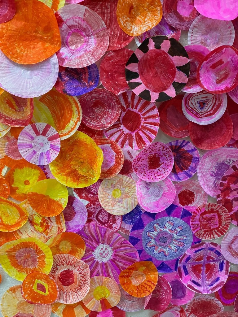 Display of paperplates painted into a display