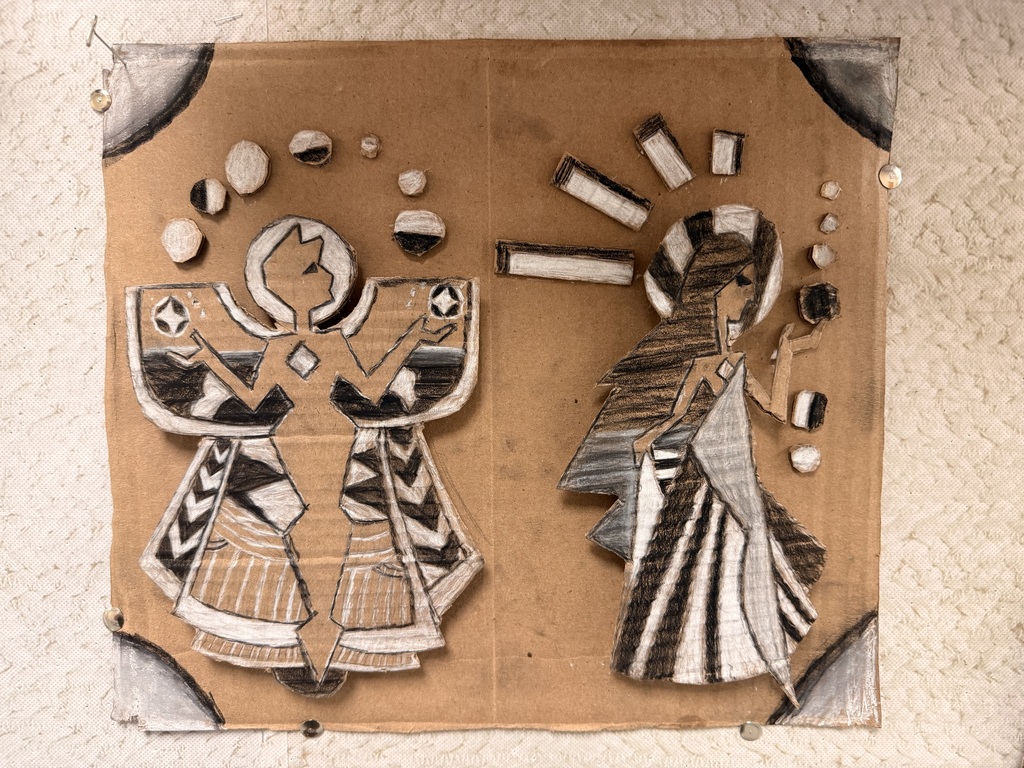 Cardboard artwork showing a cardboard background with cultural people cut out, colored in some black and white shades with colored pencils and taped or glued to the cardboard to make it 3D.