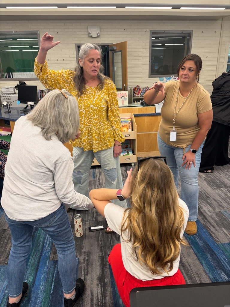 Teachers participating in a team collaboration.