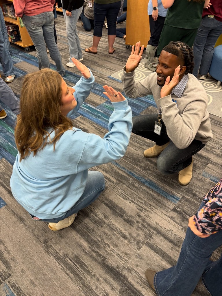 Teachers participating in a team collaboration.