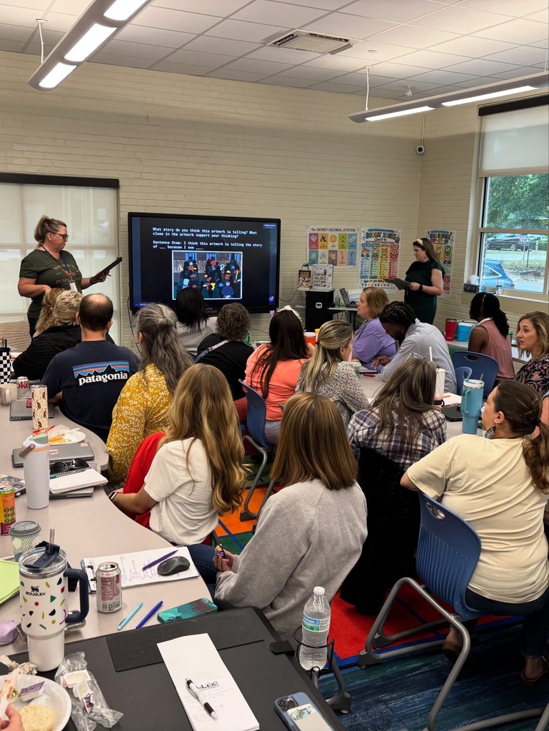 Teachers participating in a team collaboration.
