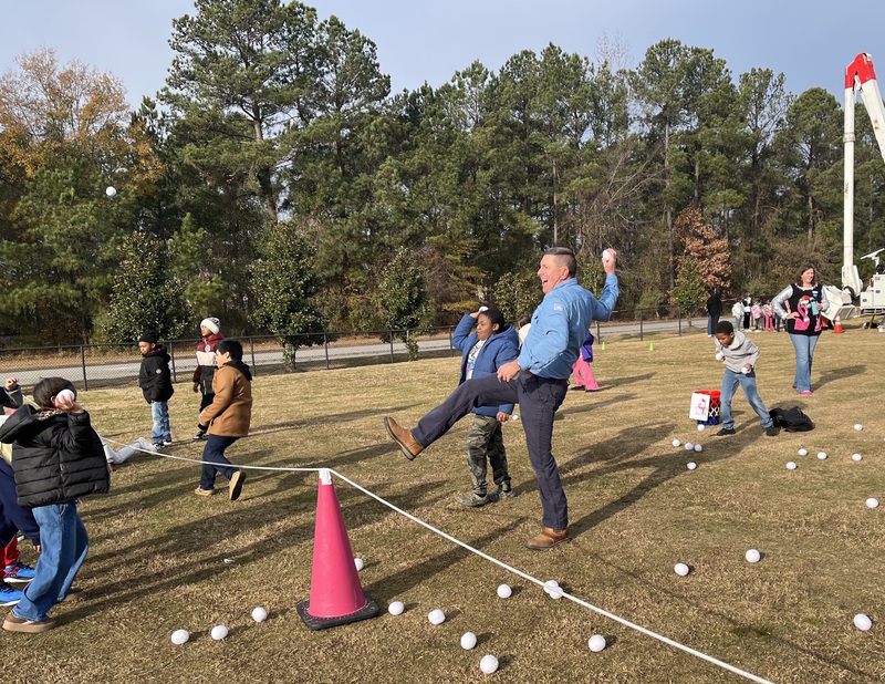 Dominion Energy's Keller Kissam tosses snowballs with students
