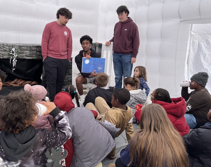 Brookland-Cayce High School students read to in the Kindness Cabin
