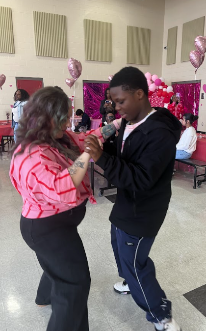 Mrs. Williams and Tristen dance at the 8th grade dance on Thursday