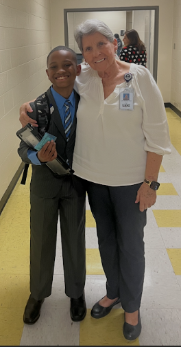 Mrs. Brown and Amire ready for the 6th grade dance on Tuesday