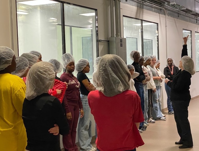 students viewing a processing line