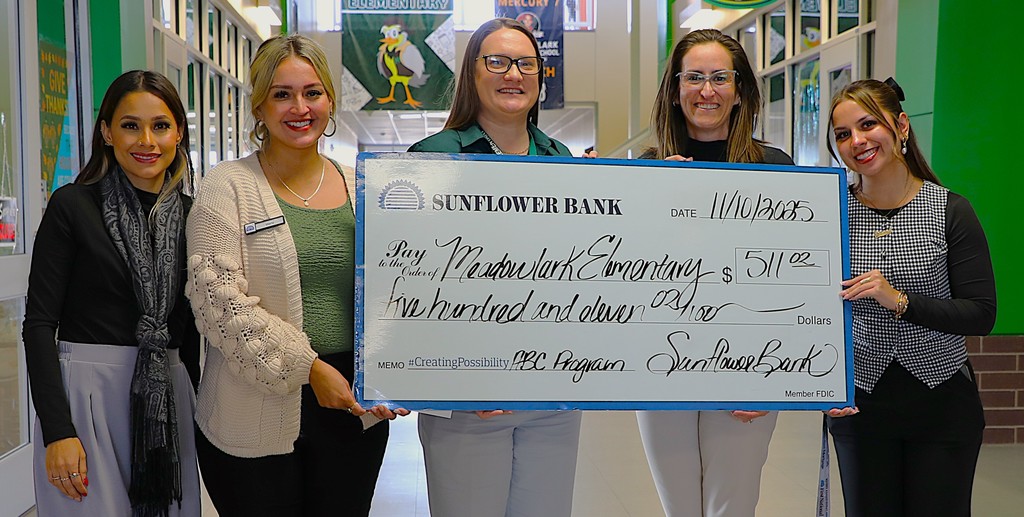 Building principals accept donation from Sunflower Bank