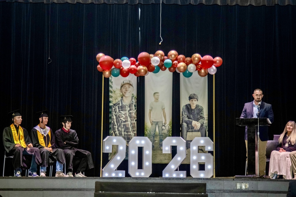 Liberty Graduates Aidan Baar, Haydan Drullinger, and Luka Kublashvili listen to Keynote Speaker, Pastor Ben Chavez of Turning Point Christian Church in Lubbock, Texas