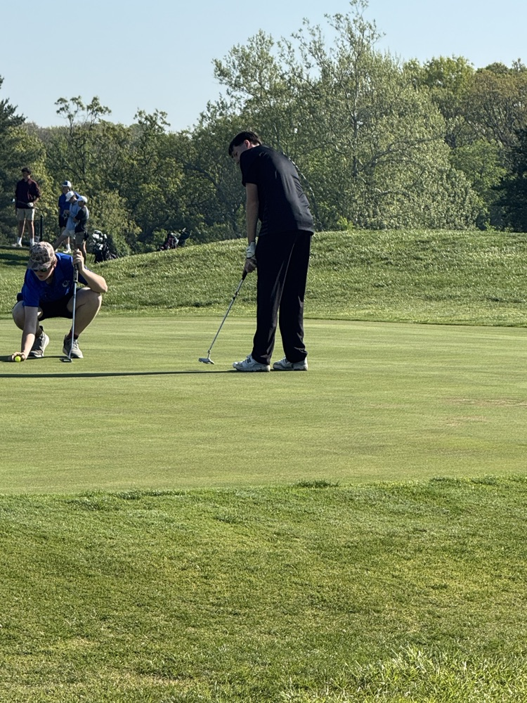 Will looks to sink a putt  