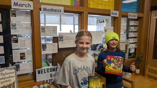 2 kids smiling for a group photo
