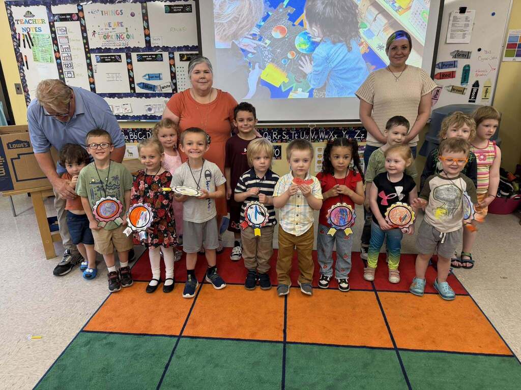 group of small kids standing for a group photo