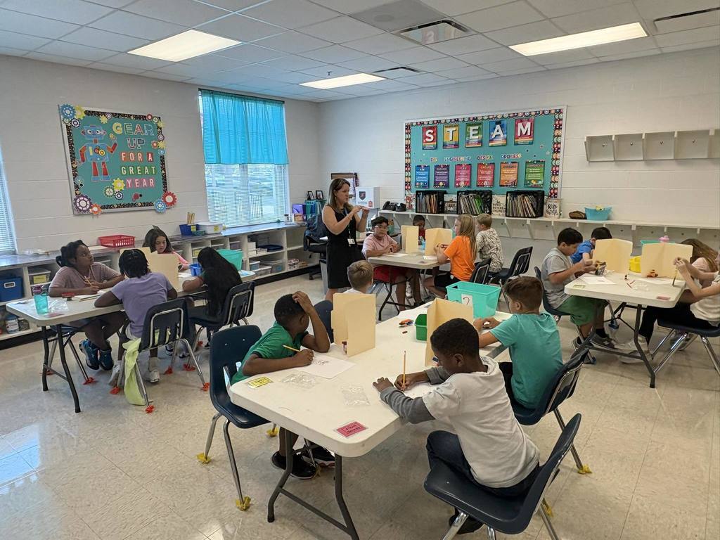 Creekside School students listen during STEM class