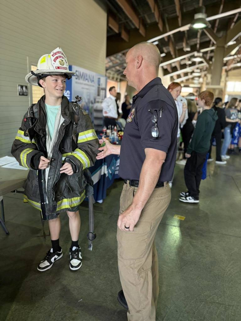 A LCS student talks with the Decatur City Fire Cheif