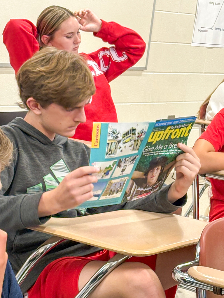 Student reading Magazine