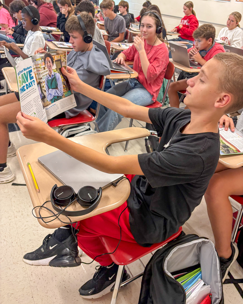 Student reading Magazine