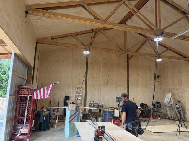 Male worker in a blue shirt working in an unfinished building