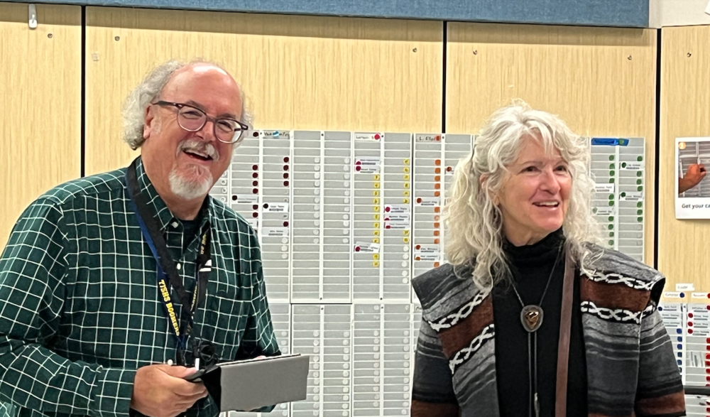 Board Chair Peter Vince swears in new board member Natalie Schaefer