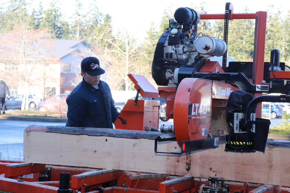 Student using wood saw