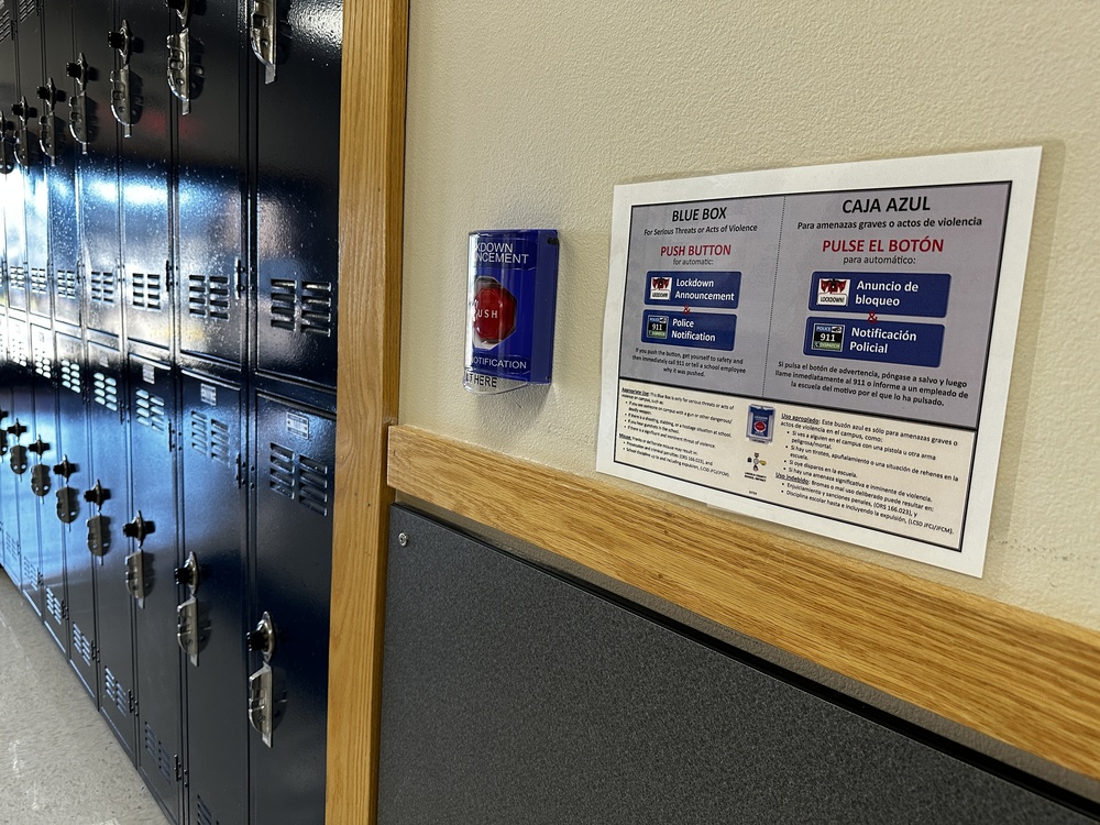 Alarm on wall by blue lockers