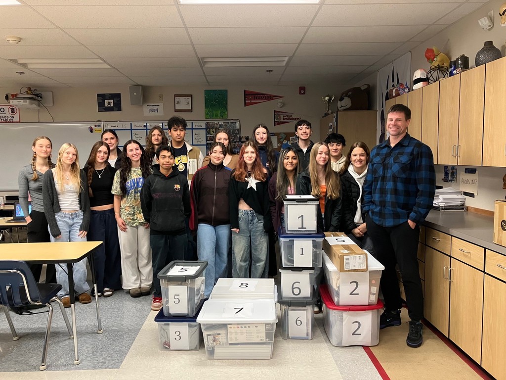 Leadership students with the donated gifts to be wrapped and given to local families in need.