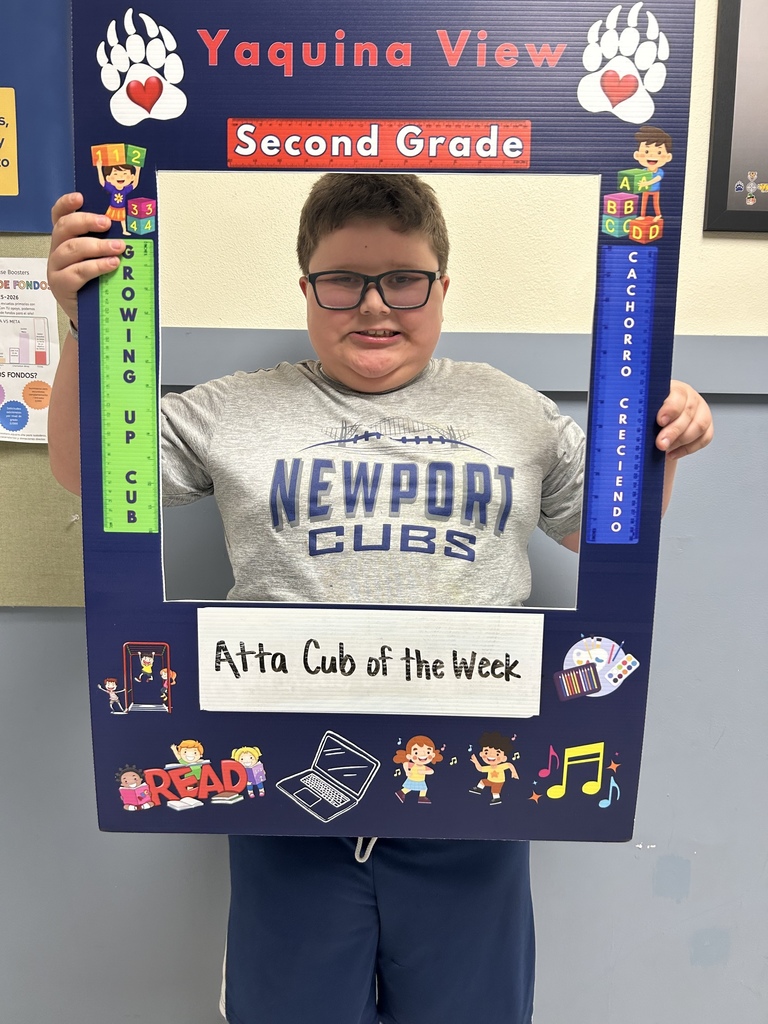 Smiling boy holding Atta Cub kid of the week frame 