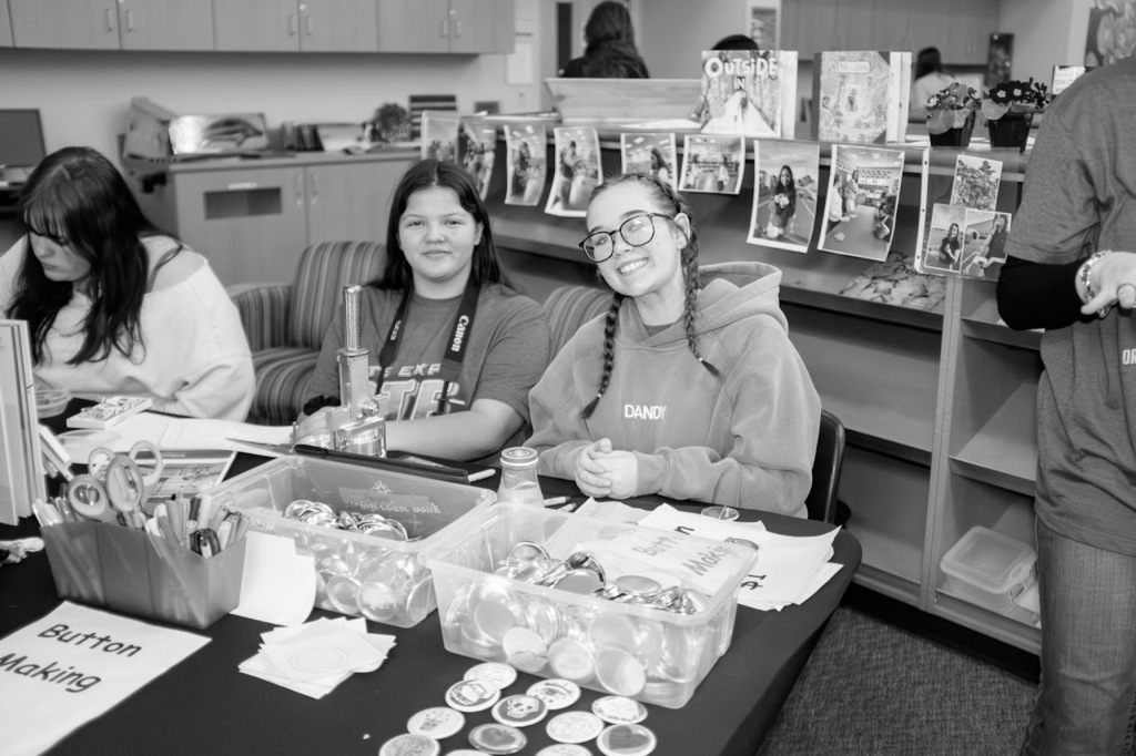 NHS students at the button making station.