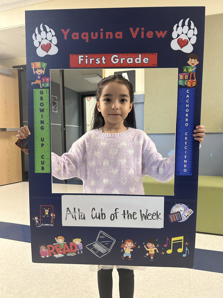 Smiling girl hold Atta Cub Kid of the Week