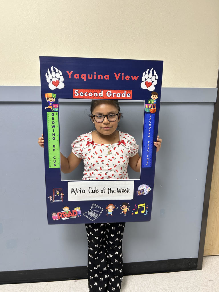 Smiling girl hold Atta Cub Kid of the Week