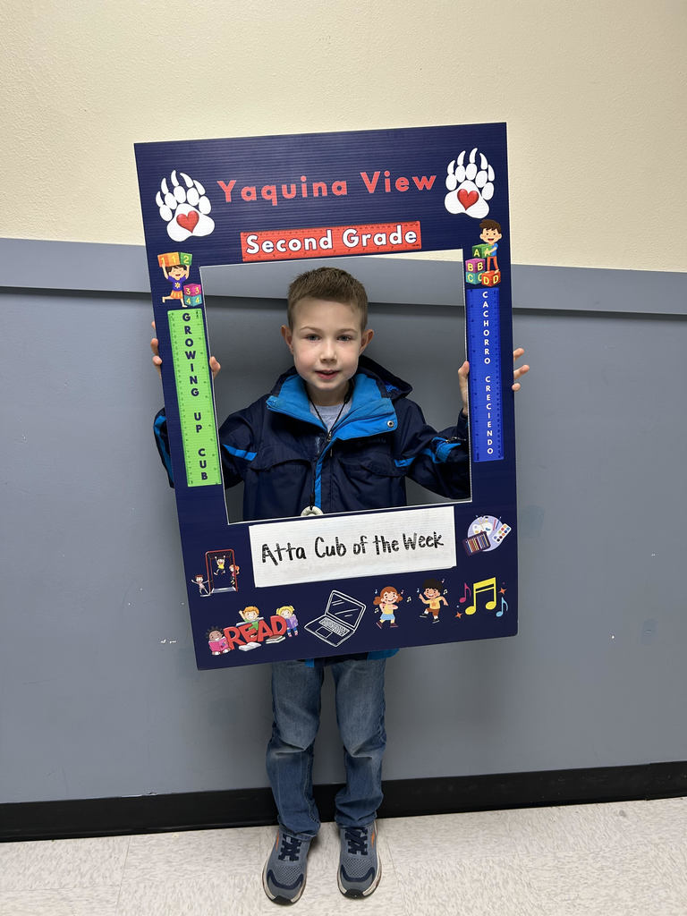 Smiling boy hold Atta Cub Kid of the Week