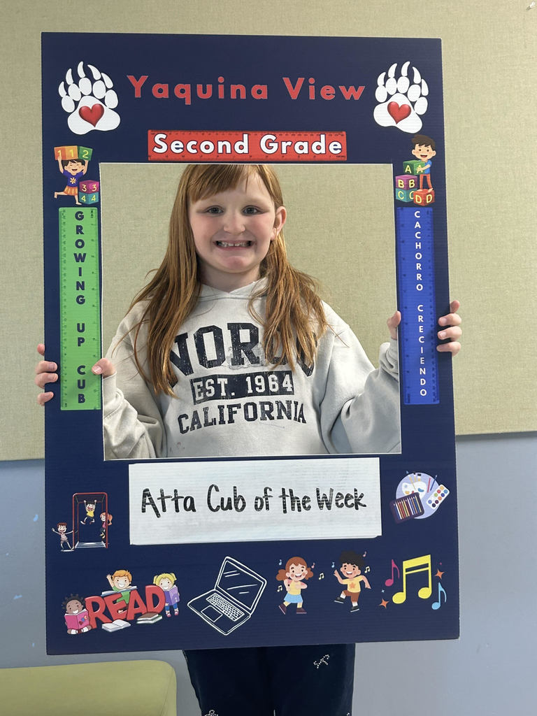 Smiling girl hold Atta Cub Kid of the Week