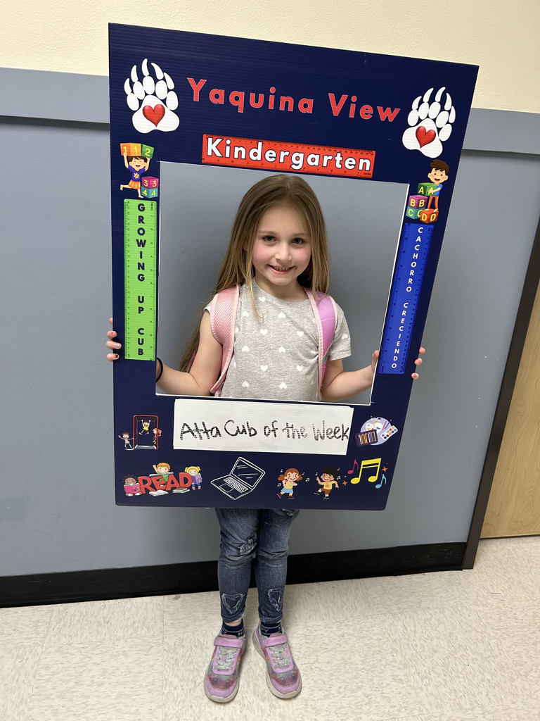 Smiling girl hold Atta Cub Kid of the Week