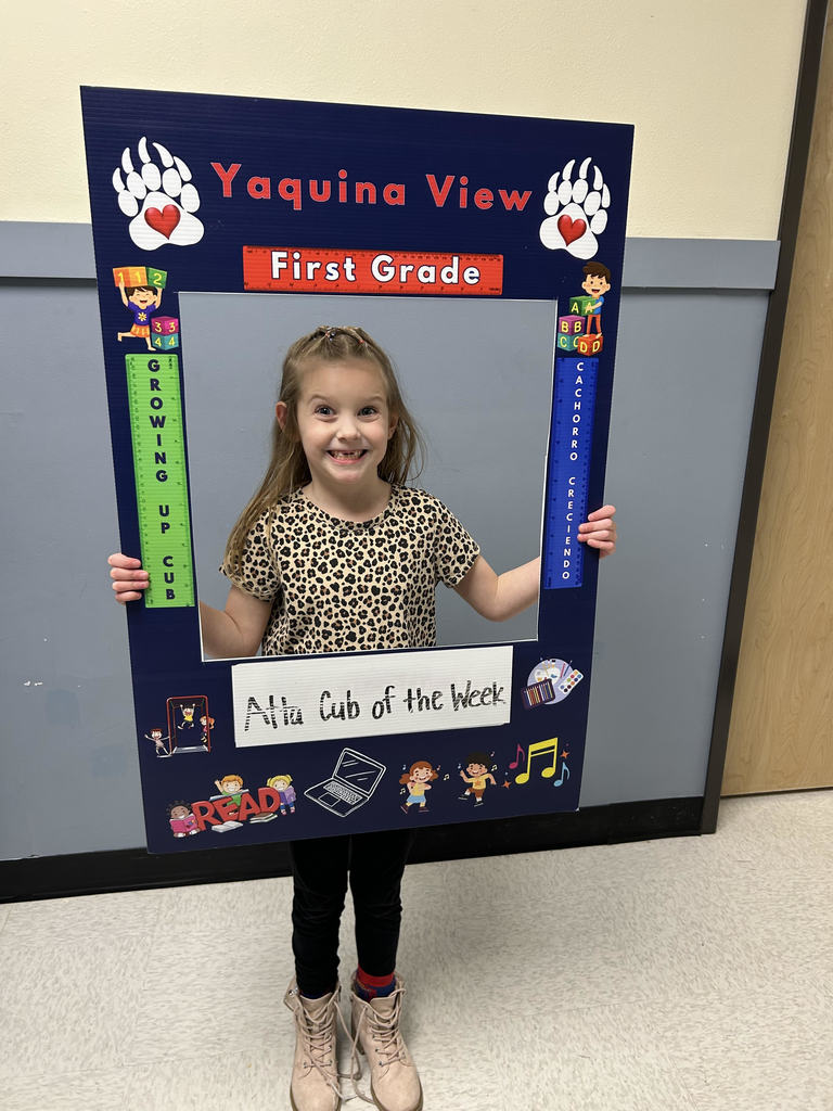 Smiling girl hold Atta Cub Kid of the Week