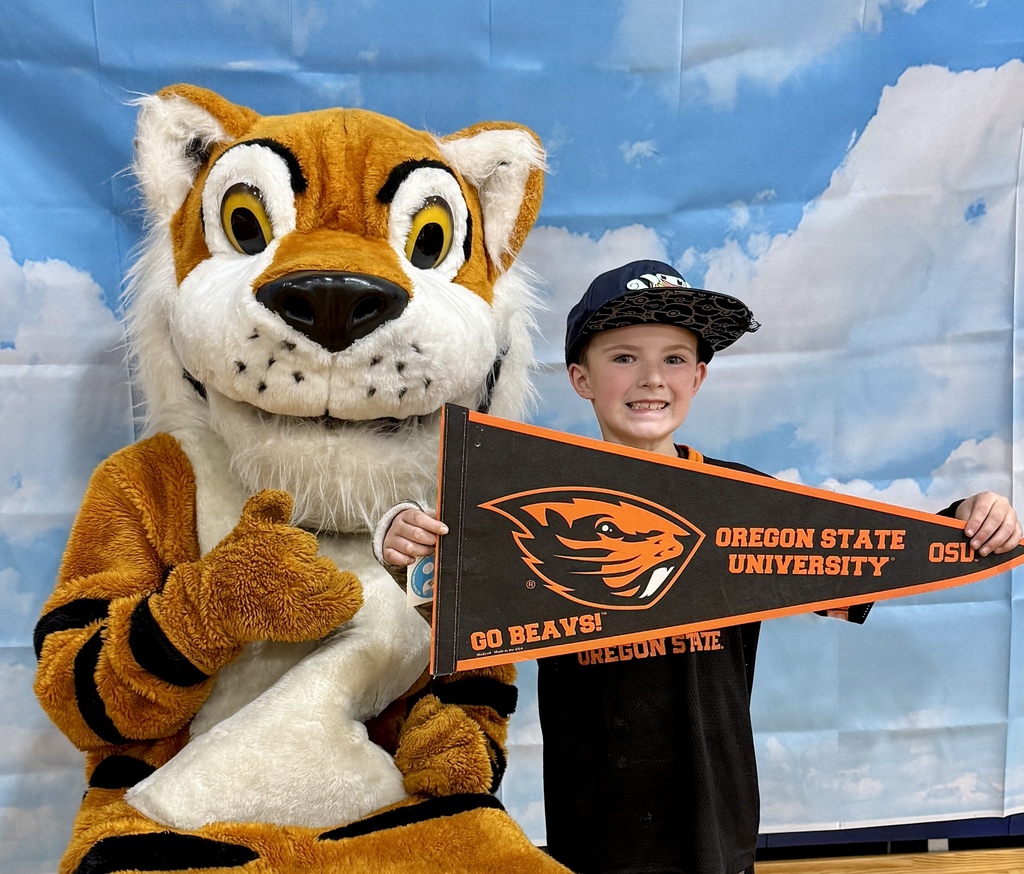 Oceanlake Family Literacy Night Attendee with Tiger Mascot