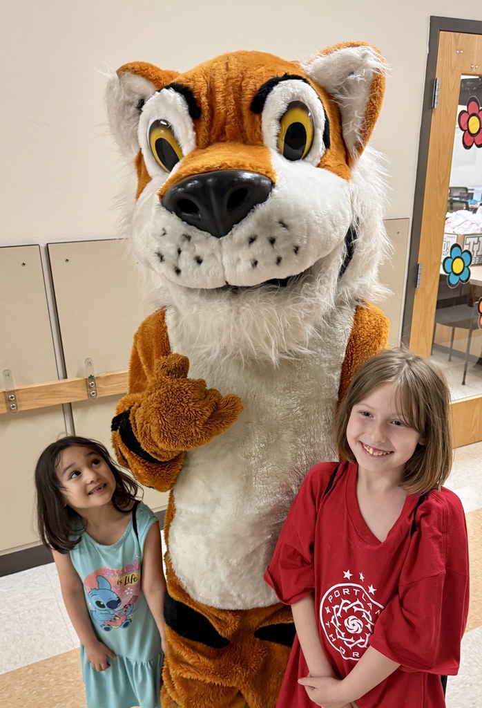 Family Literacy Night attendees with Tiger Mascot