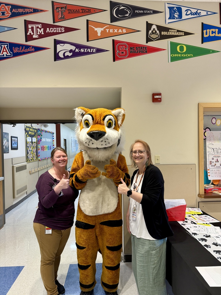 Oceanlake Family Literacy Night Attendee with Tiger Mascot