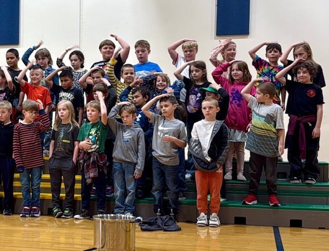 Photo of students performing in the gymnasium during OLES concert