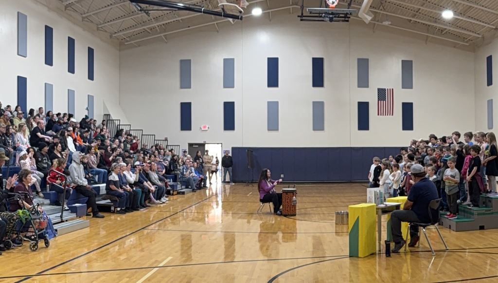 Photo of students performing in the gymnasium during OLES concert