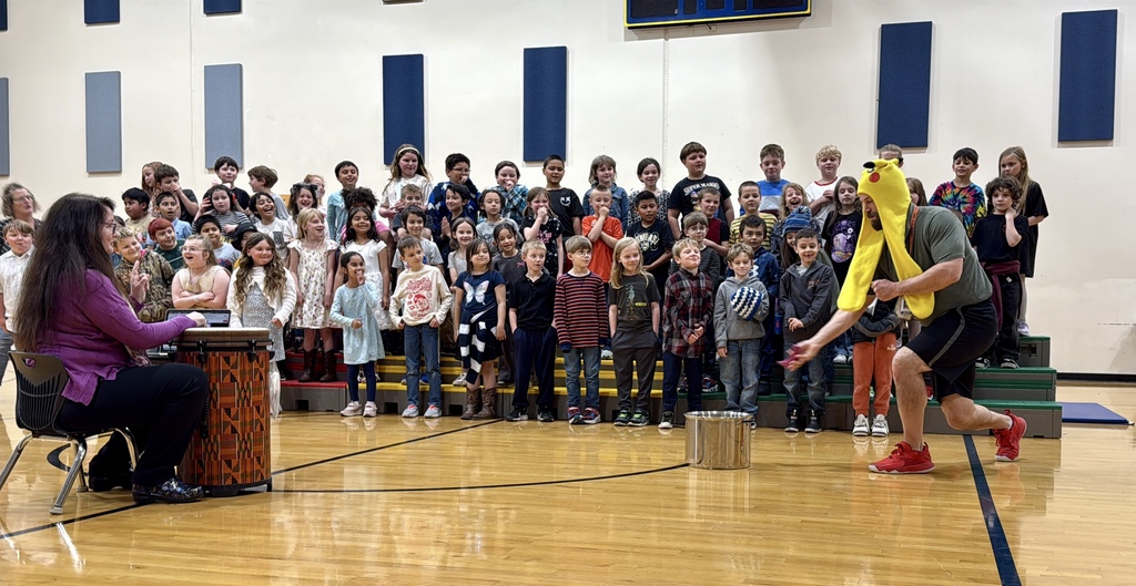 Photo of students performing in the gymnasium during OLES concert
