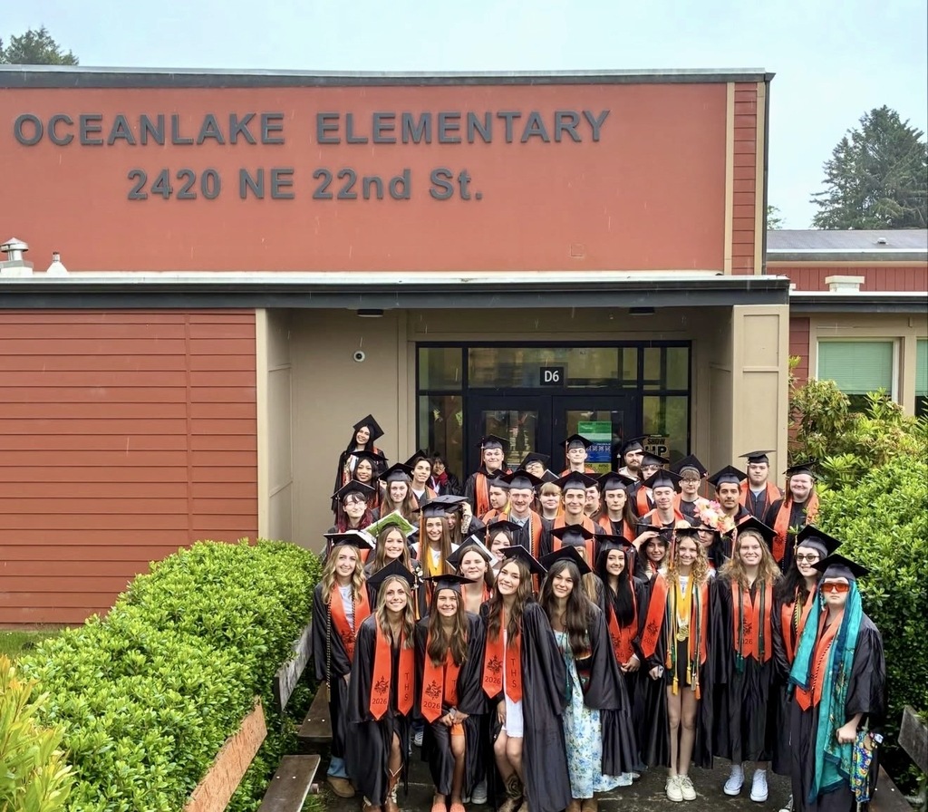 Taft 7-12 Seniors stand in front of Oceeanlake at the  Class of 2026 Cap & Gown Parade