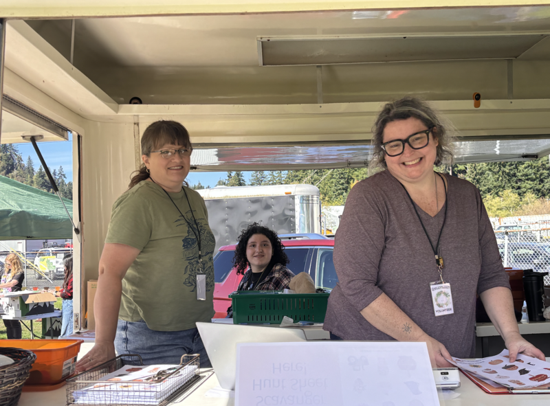2 women standing in truck