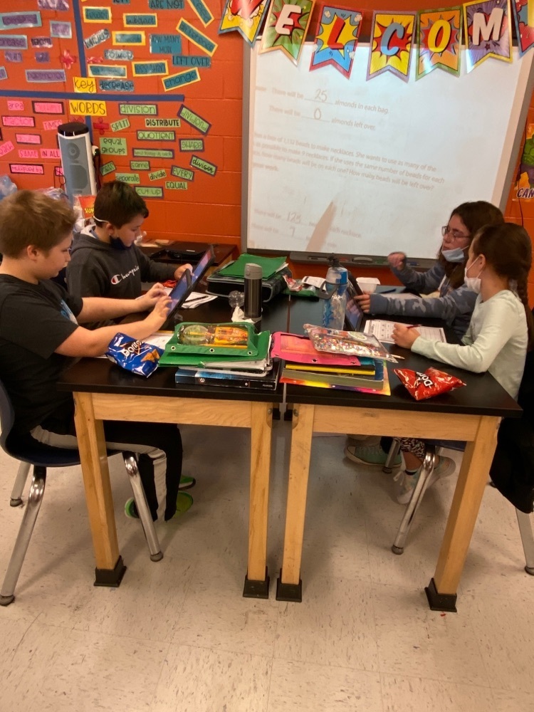 Students working together on their budgeting. 