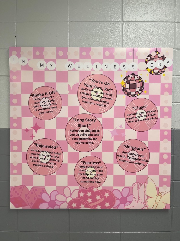 A bulletin board encouraging students to embrace their wellness era and giving ways to support their mental and emotional well-being.