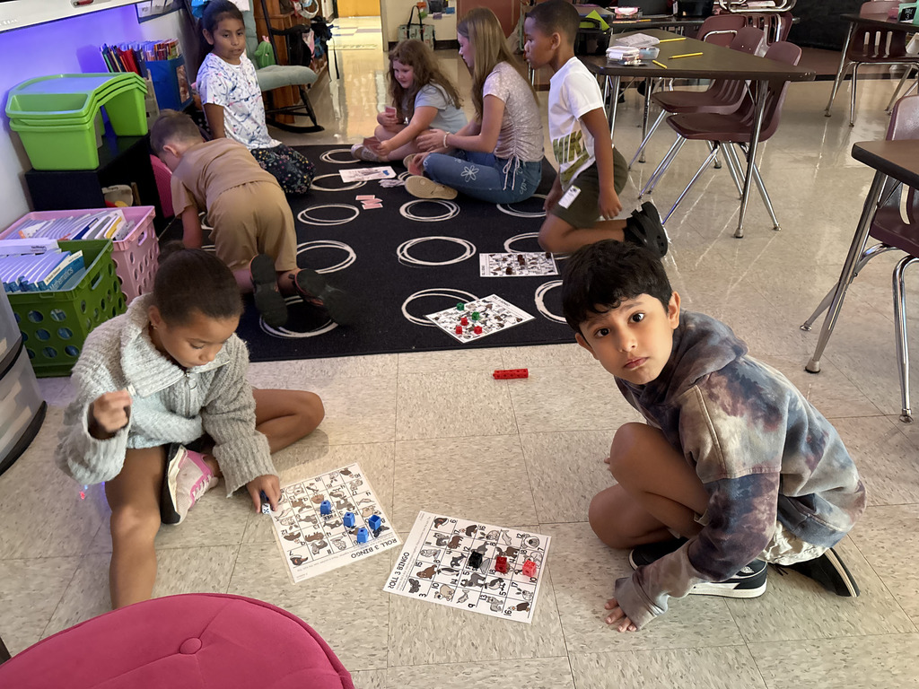 Mrs. Travis' students play bingo to practice adding three numbers.  